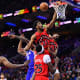 Toronto Raptors forward Thaddeus Young (21) grabs the rim after missing a shot over Philadelphia 76ers center DeAndre Jordan (9) in the second quarter at Wells Fargo Center